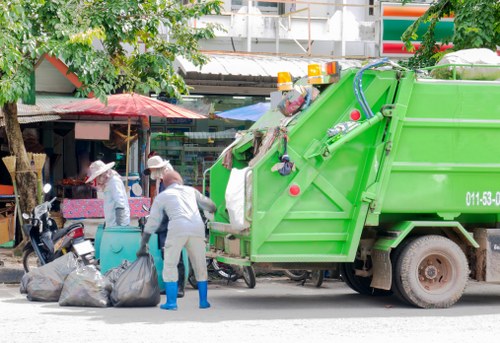 Compliance officer reviewing records for skip hire complaint resolution